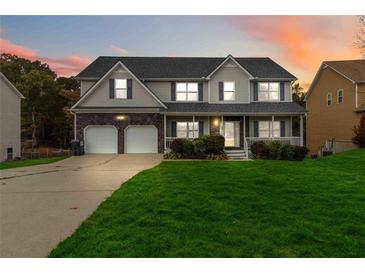 Two-story house with double garage and front yard at 4911 Crinklepoint Ct, Douglasville, GA 30134