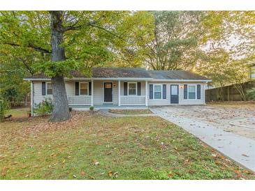 Charming ranch home with a front porch and mature landscaping at 3730 Douglas Ridge Trl, Douglasville, GA 30135