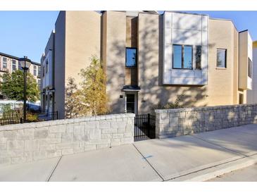 Modern brick townhome with a private entrance and a stone wall at 2194 Bristol Cove # 13, Chamblee, GA 30341