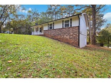 Ranch home with brick facade and a spacious yard at 117 Neal Ave, Stockbridge, GA 30281