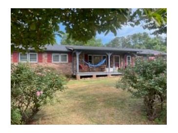 Ranch home with covered porch and large yard at 745 Shiloh Nw Rd, Kennesaw, GA 30144