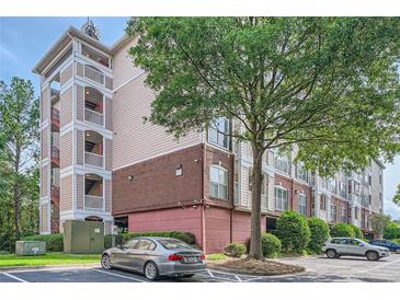 Multi-story building with brick and siding, and ample parking at 4333 Dunwoody Park # 3401, Dunwoody, GA 30338