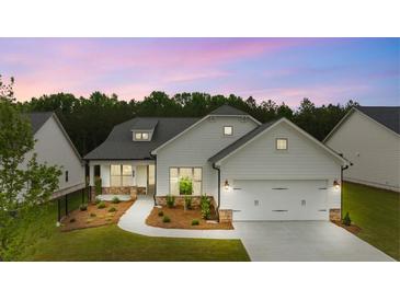 Two-story craftsman style home with a two-car garage at 3719 Tielman St, Snellville, GA 30078