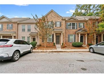 Brick townhouse with front yard and parking at 2357 Bayrose Cir # 57B, East Point, GA 30344
