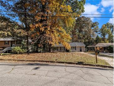 House exterior with fall leaves and trees at 2887 Rockcliff Se Rd, Atlanta, GA 30316