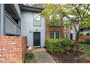 Brick townhouse exterior with private entrance and landscaping at 1108 Weatherstone Ne Dr, Atlanta, GA 30324