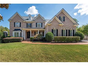 Brick house exterior with manicured lawn and landscaping at 3993 N Ivy Ne Rd, Atlanta, GA 30342