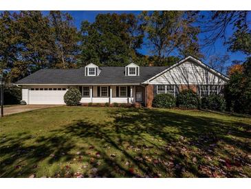 Charming ranch home with mature landscaping and attached garage at 3766 Citation Dr, Decatur, GA 30034