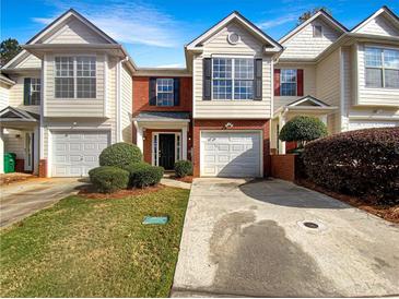 Two story townhome with two car garage and landscaping at 3781 Harvest Dr, Decatur, GA 30034