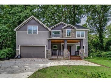 Two-story Craftsman home with stone accents and a covered porch at 1397 Thomas Rd, Decatur, GA 30030