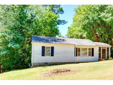 Ranch-style home with white siding and dark shutters at 3580 Orchard Cir, Decatur, GA 30032