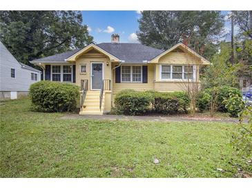 Charming yellow brick ranch house with well-manicured lawn at 1778 Campbellton Sw Rd, Atlanta, GA 30311