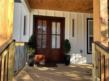 Inviting front porch with double doors and wood accents at 974 Coleman Sw St, Atlanta, GA 30310