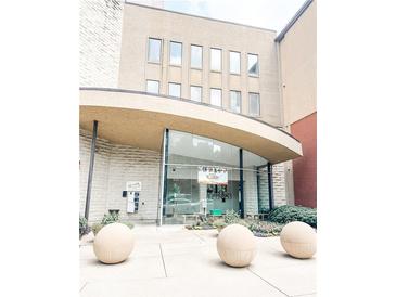 Modern building exterior with glass entryway and landscaping at 400 17Th Nw St # 1253, Atlanta, GA 30363