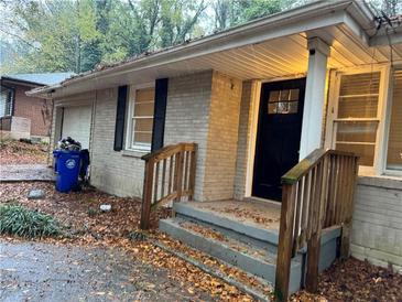 Brick ranch house exterior, front entrance, steps, and landscaping at 3137 Mcafee Rd, Decatur, GA 30032