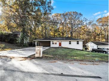 Ranch style home with carport, and a spacious yard at 3811 Paul St, Douglasville, GA 30135
