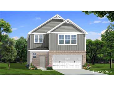 Two-story home with gray siding, brick accents, and a two-car garage at 16 Camellia Dr, Fairburn, GA 30213