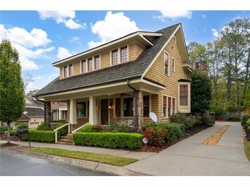 Craftsman style home with a wraparound porch and landscaped yard at 248 Fowler St, Woodstock, GA 30188