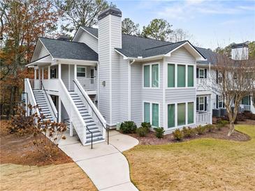 Charming two-story condo with exterior stairs and large windows at 1594 Alexandria Se Ct, Marietta, GA 30067