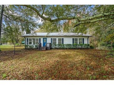 Charming ranch home with a spacious yard, offering curb appeal at 2855 Highway 20 Se, Conyers, GA 30013