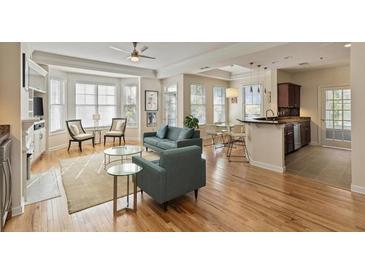 Spacious living room with hardwood floors, fireplace, and built-in shelving at 850 Piedmont Ne Ave # 1503, Atlanta, GA 30308