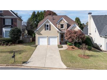 Beautiful two-story home with stone accents and a two-car garage at 1247 Nottoway Trl, Marietta, GA 30066