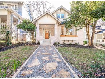 Charming renovated craftsman home with stone path and landscaped lawn at 335 4Th Ne St, Atlanta, GA 30308