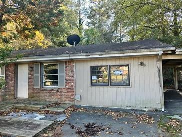 Ranch-style home with brick facade and carport at 343 Patricia Sw Ave, Marietta, GA 30060