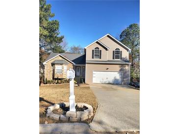 Two-story house with stone accents and a two-car garage at 4284 Caroline Ct, Douglasville, GA 30135