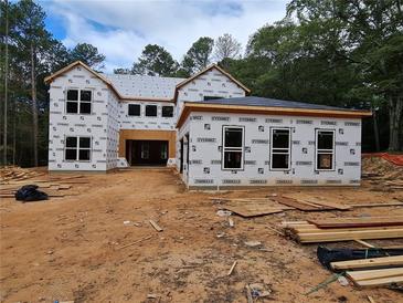 Two-story house under construction, showcasing a modern design and large windows at 1273 Grayson Pkwy, Grayson, GA 30017