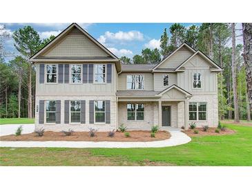 Two-story house with gray shutters and stone accents at 29 Homesite Cooper E Cv, Fayetteville, GA 30215