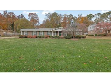 Ranch home with large yard and mature trees at 4975 Fox Forest Dr, Lilburn, GA 30047