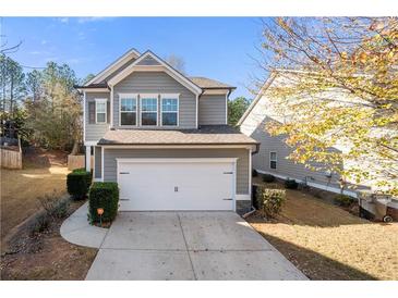 Two-story house with gray siding, white trim, and a two-car garage at 260 Royal Crescent Ter, Canton, GA 30115