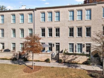 Brick townhouses with private patios and lush landscaping at 3443 Landen Pine Ne Ct, Atlanta, GA 30305