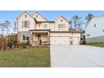 Two-story house with stone accents and a three-car garage at 2340 Ellis Mountain Dr, Marietta, GA 30064