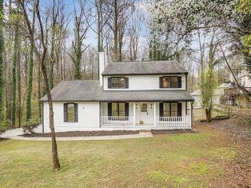 Charming two-story house with white siding, gray roof and landscaping at 5096 Shannon Sw Way, Mableton, GA 30126