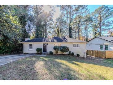 Charming ranch home with a well-maintained lawn and mature trees at 2543 Brentwood Rd, Decatur, GA 30032