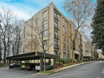 Exterior view of a modern residential building with covered parking and landscaped grounds at 2769 Peachtree Ne Rd # 10, Atlanta, GA 30305