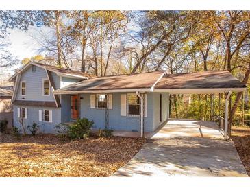 Ranch style home with carport and mature trees at 2080 Bluffton Way, Decatur, GA 30035