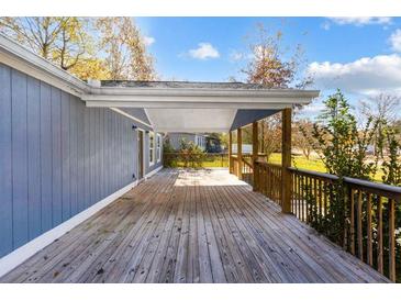 Spacious wooden deck with railings, providing ample outdoor space at 70 Caroline Ave, Stockbridge, GA 30281