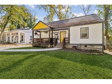Charming craftsman bungalow with a modern farmhouse exterior and a welcoming front porch at 1770 South Olympian Sw Way, Atlanta, GA 30310