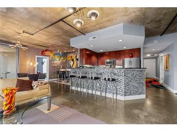 Modern kitchen with stainless steel appliances and granite countertops at 285 Centennial Olympic Park Nw Dr # 401, Atlanta, GA 30313