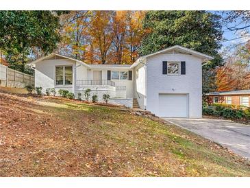 Charming ranch home with a freshly painted exterior and landscaped yard at 3824 Montford Dr, Atlanta, GA 30341