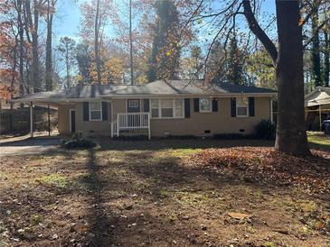 Brick ranch home with covered porch and mature trees at 245 Bromack Se Dr, Atlanta, GA 30315