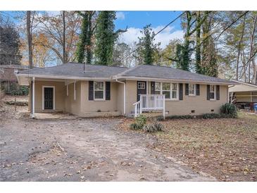 Ranch style home with brick facade, landscaping, and a covered carport at 245 Bromack Se Dr, Atlanta, GA 30315