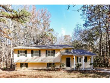 Ranch style home with mature trees and landscaping at 1034 Sandy Ridge Rd, Mcdonough, GA 30252