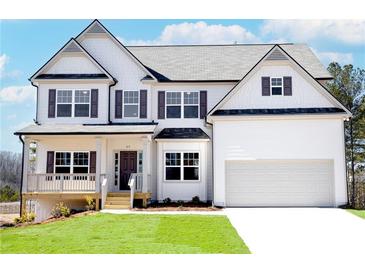 Two story house with gray roof, white siding, and a two car garage at 630 Edgemore Rd, Canton, GA 30114