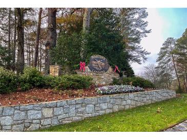 Stone entrance sign of Martins Landing community with festive holiday decor at 1845 Branch Valley Dr, Roswell, GA 30076
