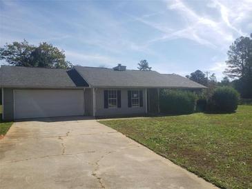 Ranch style home with attached garage and spacious yard at 10 Oak Wood Ln, Covington, GA 30016