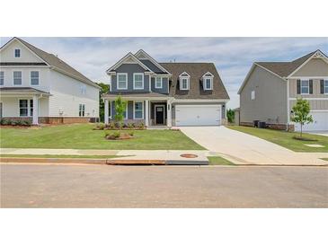 Two-story house with gray siding, white trim, and a two-car garage at 246 Arnewood Cir, Mcdonough, GA 30253